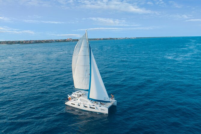 Half-Day Luxury Sailing Experience in Tulum with Open Bar - Boarding and onboard setup: life jackets, toys, and a smooth start