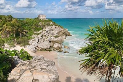 Private Tour Tulum Tortugas Cenote Beach All Inclusive - Entering Tulum Ruins with cliffside views and a guided walk
