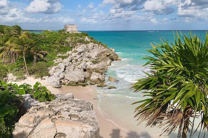 Private Tour Tulum Tortugas Cenote Beach All Inclusive - Entering Tulum Ruins with cliffside views and a guided walk